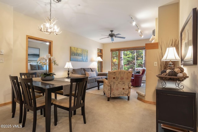 627 Sawatch Dr Unit 105, Edwards, CO 81632 - dining space with light colored carpet, a chandelier, ceiling fan, and track lighting