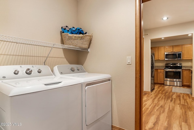 627 Sawatch Dr Unit 105, Edwards, CO 81632 - laundry area featuring separate washer and dryer, light wood finished floors, and recessed lighting
