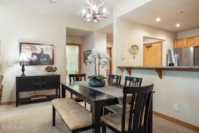 627 Sawatch Dr Unit 105, Edwards, CO 81632 - dining space with light colored carpet, a chandelier, and recessed lighting