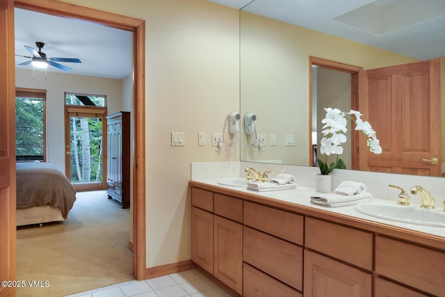 627 Sawatch Dr Unit 105, Edwards, CO 81632 - ensuite bathroom featuring double vanity, ceiling fan, and tile patterned flooring