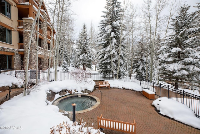 view of snow covered pool