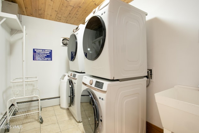 103 Willow Pl Unit 203, Vail, CO 81657 - laundry area featuring stacked washer / drying machine, light tile patterned floors, and wood ceiling