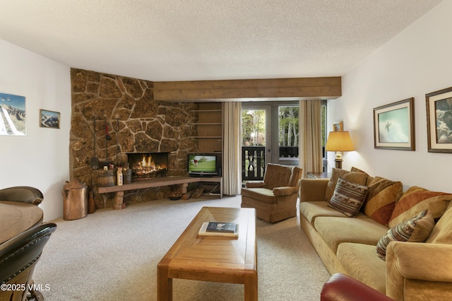 103 Willow Pl Unit 203, Vail, CO 81657 - living room featuring carpet floors, a textured ceiling, and a stone fireplace
