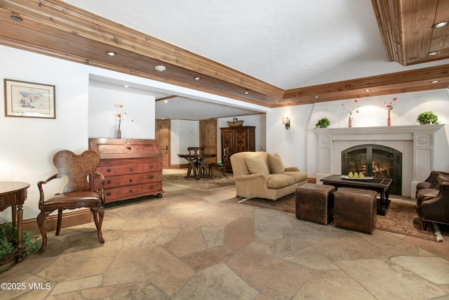 103 Willow Pl Unit 203, Vail, CO 81657 - living room featuring stone tile flooring and a glass covered fireplace