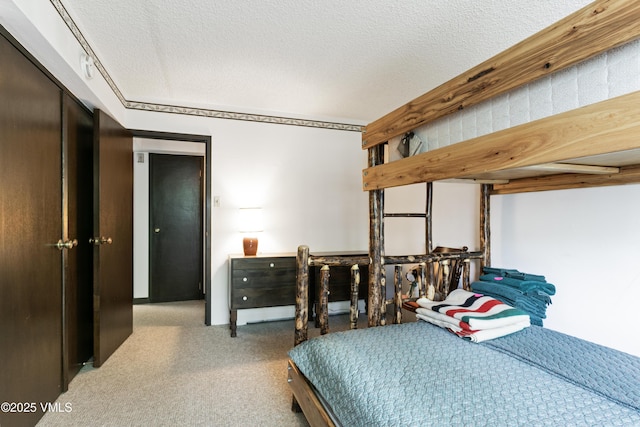 103 Willow Pl Unit 203, Vail, CO 81657 - carpeted bedroom featuring a textured ceiling