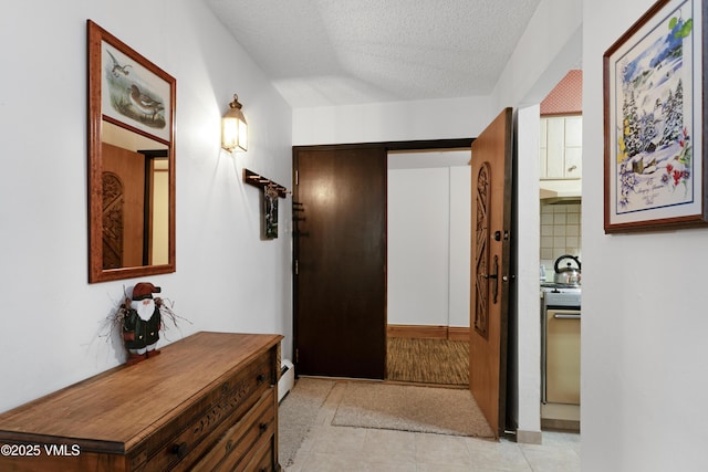 103 Willow Pl Unit 203, Vail, CO 81657 - hall with a textured ceiling and light tile patterned floors