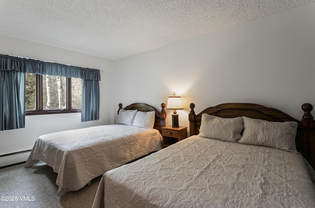 103 Willow Pl Unit 203, Vail, CO 81657 - carpeted bedroom featuring a textured ceiling and a baseboard heating unit