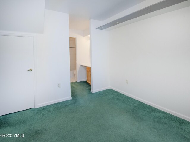 205 Crazy Horse Pt Unit 205, Edwards, CO 81632 - unfurnished bedroom featuring carpet flooring and baseboards