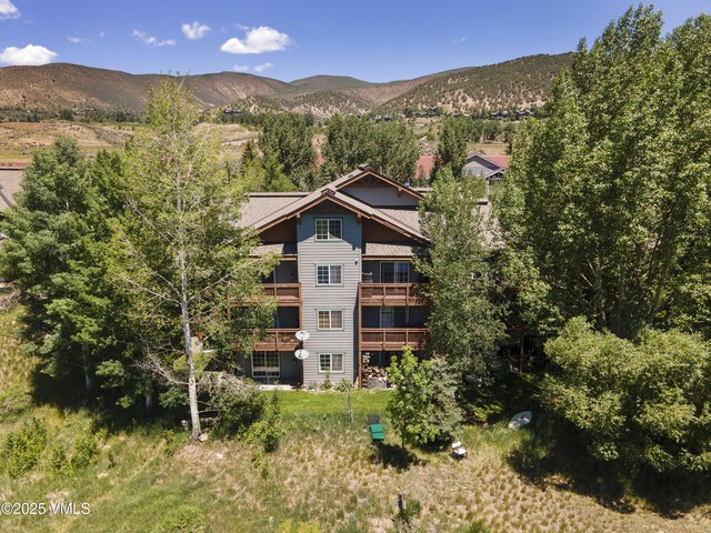 205 Crazy Horse Pt Unit 205, Edwards, CO 81632 - back of house with a mountain view and a balcony