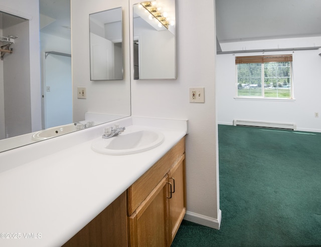 205 Crazy Horse Pt Unit 205, Edwards, CO 81632 - bathroom featuring baseboard heating and vanity