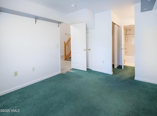 205 Crazy Horse Pt Unit 205, Edwards, CO 81632 - unfurnished bedroom with carpet floors and ensuite bathroom