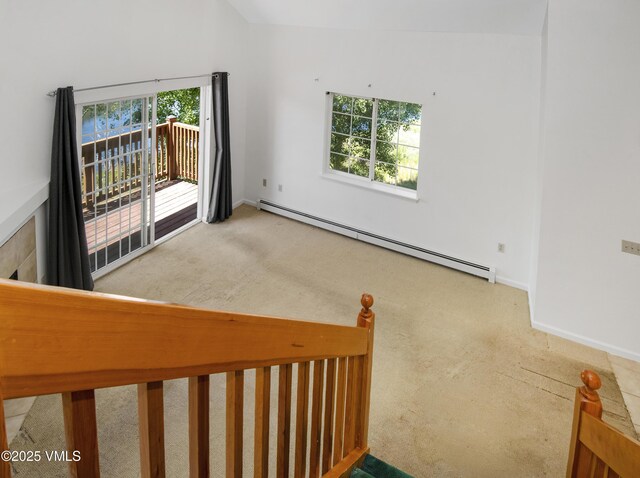 205 Crazy Horse Pt Unit 205, Edwards, CO 81632 - carpeted empty room featuring a baseboard heating unit and baseboards