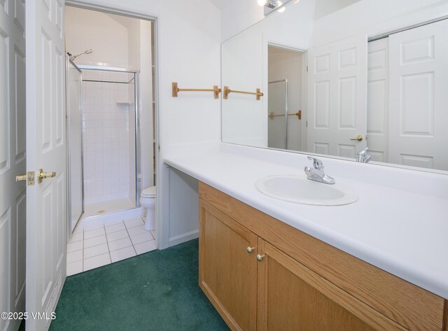 205 Crazy Horse Pt Unit 205, Edwards, CO 81632 - full bath featuring a stall shower, vanity, and tile patterned flooring