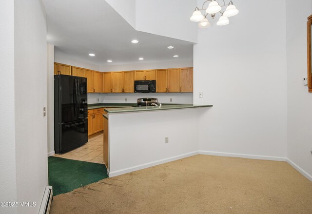 205 Crazy Horse Pt Unit 205, Edwards, CO 81632 - kitchen with black appliances, light colored carpet, recessed lighting, a chandelier, and dark countertops