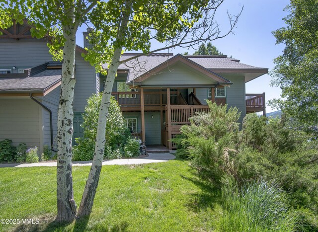 205 Crazy Horse Pt Unit 205, Edwards, CO 81632 - view of front of house with a front lawn and roof with shingles