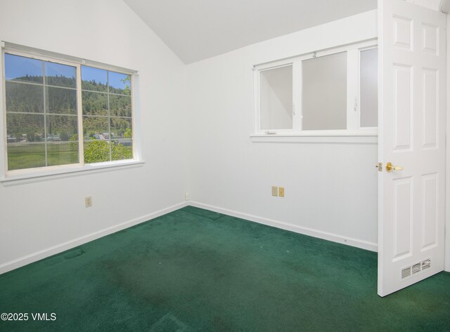 205 Crazy Horse Pt Unit 205, Edwards, CO 81632 - carpeted spare room with vaulted ceiling and baseboards