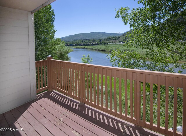 205 Crazy Horse Pt Unit 205, Edwards, CO 81632 - wooden terrace featuring a water and mountain view