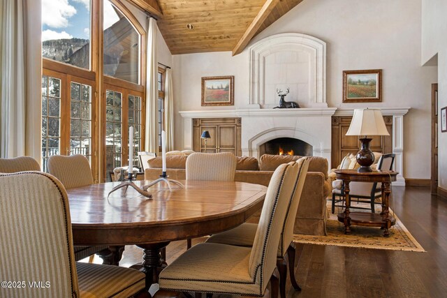 312 Holden Rd, Beaver Creek, CO 81620 - dining space featuring wooden ceiling, wood finished floors, a fireplace, baseboards, and high vaulted ceiling