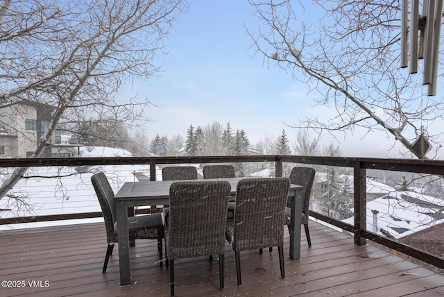 wooden deck featuring outdoor dining area