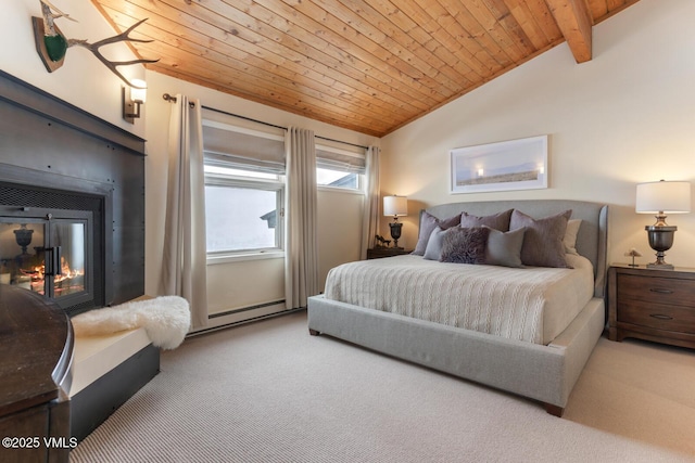 carpeted bedroom with a baseboard heating unit, lofted ceiling with beams, wood ceiling, and a glass covered fireplace