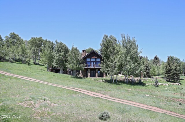 exterior space featuring a front lawn