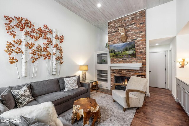 living room featuring dark wood-type flooring, high vaulted ceiling, a brick fireplace, and wooden ceiling