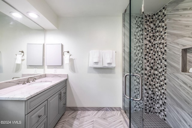 bathroom with walk in shower and vanity