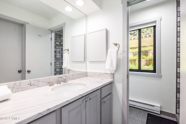 bathroom with vanity and a baseboard radiator