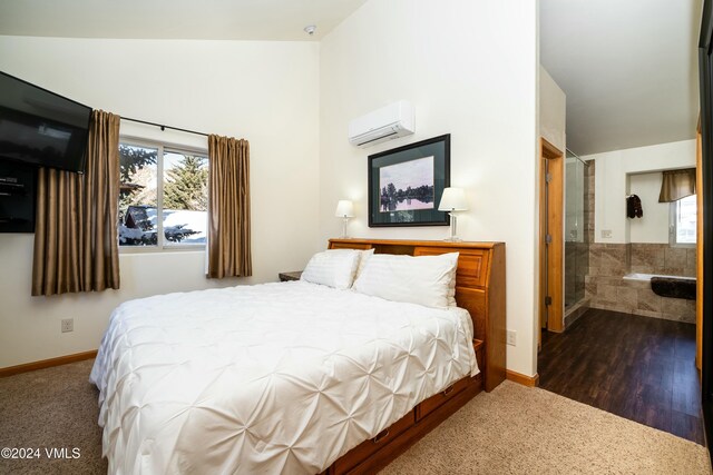 bedroom with a wall mounted AC, high vaulted ceiling, and multiple windows