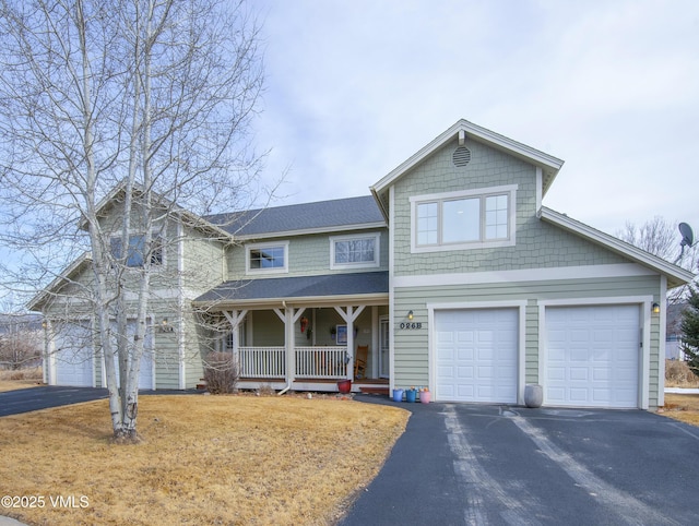 view of front of property featuring a garage and a porch