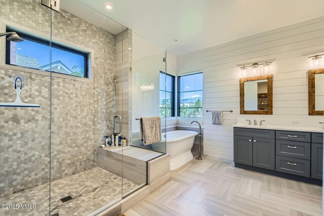 146 Robins Egg Ln, Eagle, CO 81631 - full bathroom featuring double vanity, a soaking tub, and a stall shower