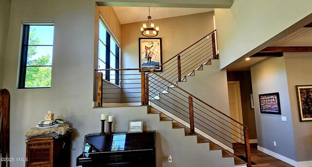 146 Robins Egg Ln, Eagle, CO 81631 - stairway with a chandelier and wood finished floors