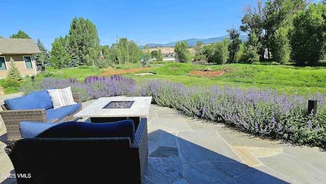 146 Robins Egg Ln, Eagle, CO 81631 - view of patio featuring a mountain view and an outdoor living space with a fire pit