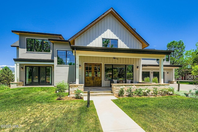 146 Robins Egg Ln, Eagle, CO 81631 - view of front of property featuring french doors, board and batten siding, a front yard, and a porch