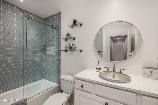 5780 Wildridge Rd E Unit A, Avon, CO 81620 - bathroom featuring vanity, combined bath / shower with glass door, and toilet
