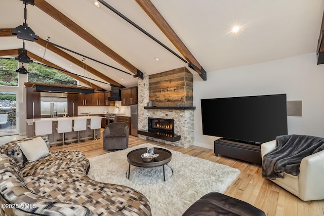 5780 Wildridge Rd E Unit A, Avon, CO 81620 - living room featuring light wood finished floors, a fireplace, and recessed lighting