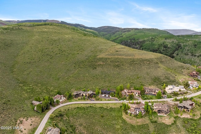 5780 Wildridge Rd E Unit A, Avon, CO 81620 - aerial view of property and surrounding area featuring a mountainous background and nearby suburban area