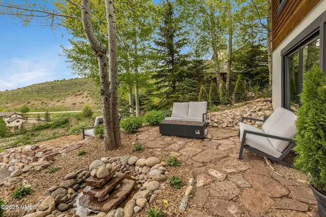 5780 Wildridge Rd E Unit A, Avon, CO 81620 - view of patio / terrace featuring an outdoor fire pit