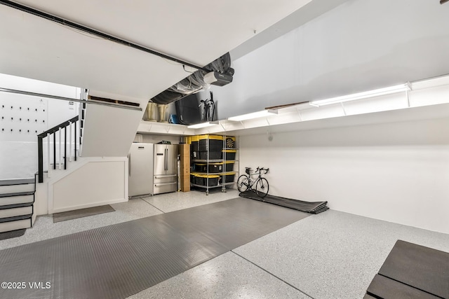 5780 Wildridge Rd E Unit A, Avon, CO 81620 - garage with freestanding refrigerator and a garage door opener