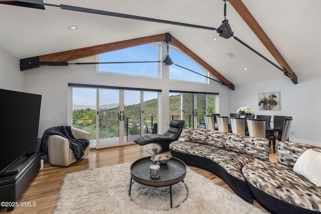 5780 Wildridge Rd E Unit A, Avon, CO 81620 - living area with wood finished floors, a mountain view, and recessed lighting