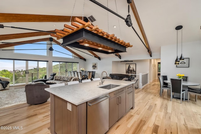 5780 Wildridge Rd E Unit A, Avon, CO 81620 - kitchen featuring a sink, open floor plan, dishwasher, and light wood finished floors