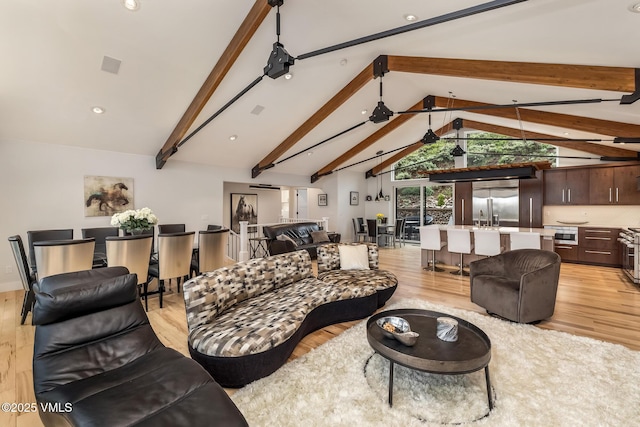 5780 Wildridge Rd E Unit A, Avon, CO 81620 - living area with light wood-type flooring, beam ceiling, high vaulted ceiling, and recessed lighting