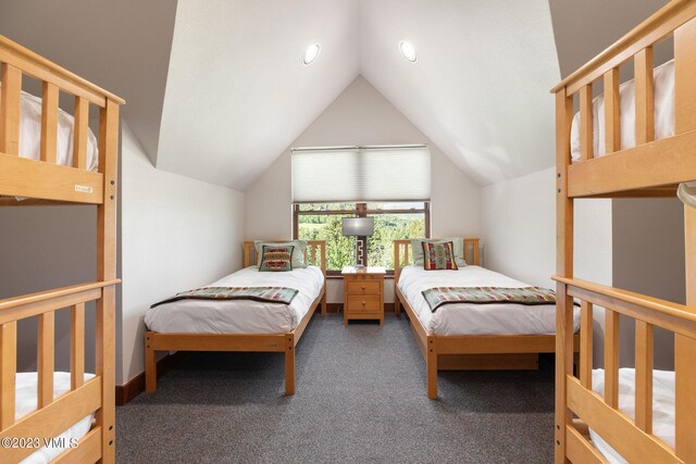 carpeted bedroom featuring lofted ceiling