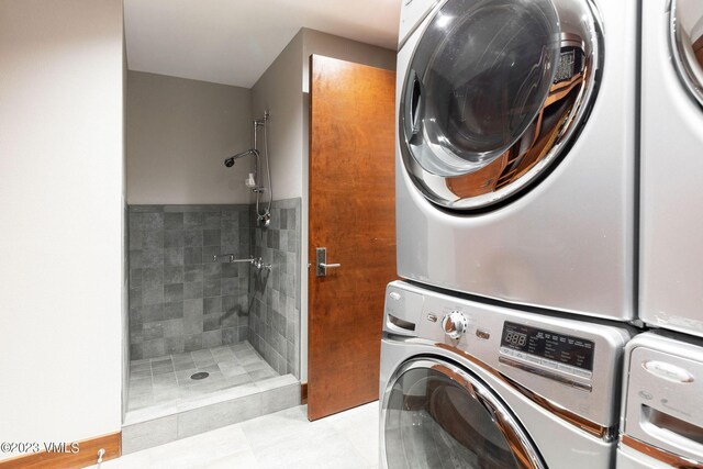 laundry area with stacked washer and clothes dryer