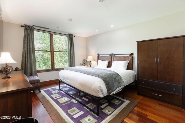 bedroom featuring dark hardwood / wood-style flooring