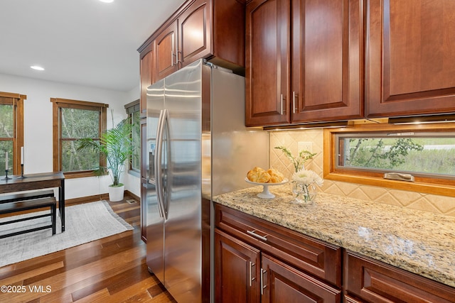 4254 Columbine Way Unit 9, Vail, CO 81657 - kitchen featuring dark wood finished floors, light stone counters, tasteful backsplash, recessed lighting, and stainless steel fridge with ice dispenser