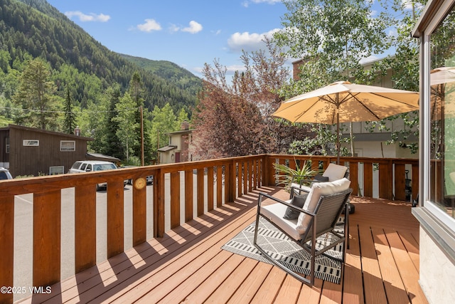 4254 Columbine Way Unit 9, Vail, CO 81657 - wooden deck featuring a wooded view and a mountain view