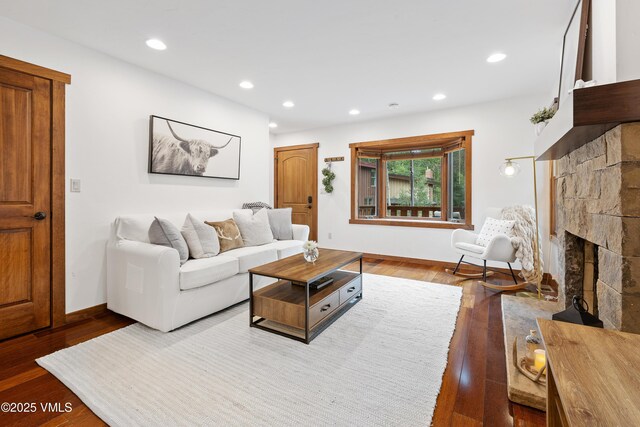 4254 Columbine Way Unit 9, Vail, CO 81657 - living room featuring wood finished floors, recessed lighting, and a fireplace