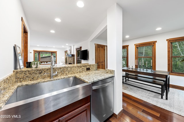 4254 Columbine Way Unit 9, Vail, CO 81657 - kitchen featuring stainless steel dishwasher, recessed lighting, dark wood-style flooring, and light stone counters
