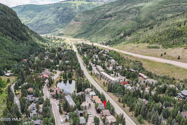 4254 Columbine Way Unit 9, Vail, CO 81657 - aerial overview of property's location with a mountain backdrop and a forest